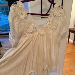 By Anthropologie handkerchief hem crocheted tee. Beautiful detail and drapey Sil